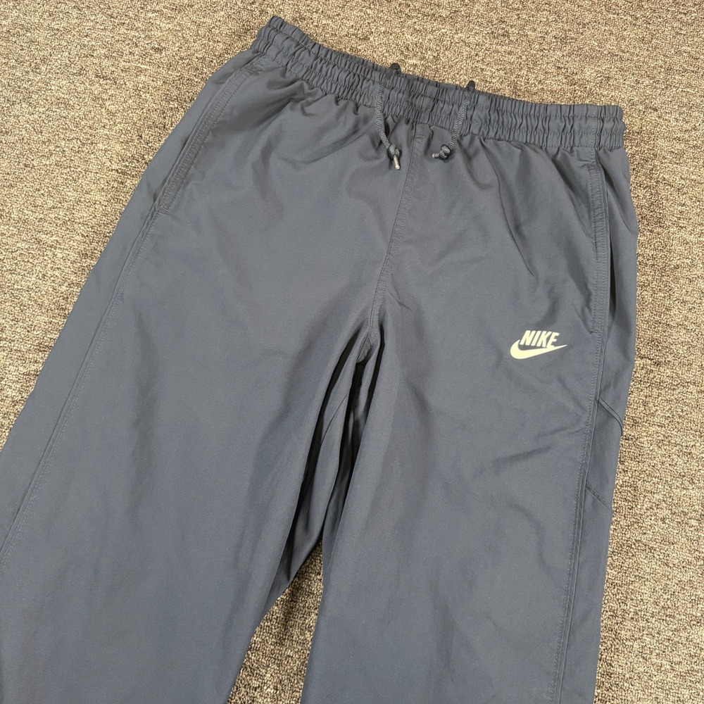 Nike Track Pants Mens Medium Navy Blue Woven Sportswear Zipper Ankle Cuffs Baggy